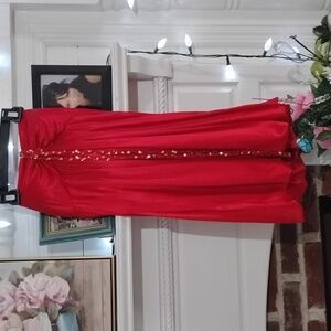 Red silky party dress with gold shing v neck tie straps